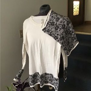 White Sweater with detachable scarf.